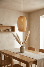 Hana Cocoon woven bamboo pendant light above an oak dining table in a Japandi dining room