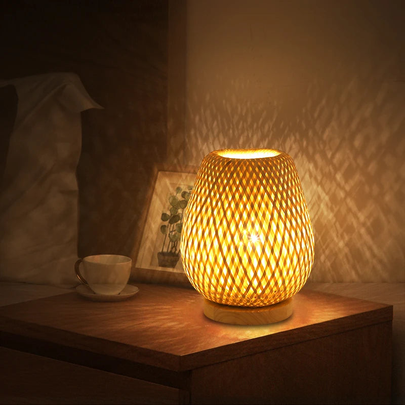 Cocoon woven bamboo table lamp glowing at night – Maison Liane