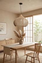 Panier Goutte rattan pendant light above an oak dining table in a Japandi dining room