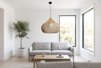 Panier Goutte rattan pendant light in a bright Scandinavian living room