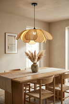 Petale rattan flower pendant light above an oak dining table in a Japandi dining room